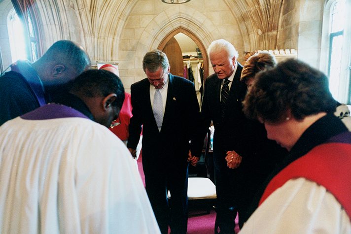 Billy Graham praying with George Bush