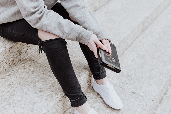 Person holding Bible